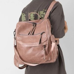 Pink vegan leather zipper detail mini backpacks